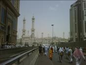 The day time view from street level of pilgrims walking towards the holy Masjid Al Haram during the afternoon and walking towards the Mosque at the Royal Quarters end where normally the King of Saudi and his Royal family resides..