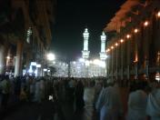 The evening view from the side of the Bin Dawood shopping centre exit, outside the street as many pilgrims are walking towards the Masjid Al Haram in Makkah Saudi Arabia during ramadhan the month of fasting where it is advisable to book cheap flights in advance for flights from heathrow