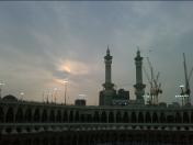 The sunset view of the Masjid Al Haram after the Asar prayers, helicoptors fly past the mosque, visitors to Makkah should always pre book their flight tickets at least a month in advance to get a good deal on airline flights